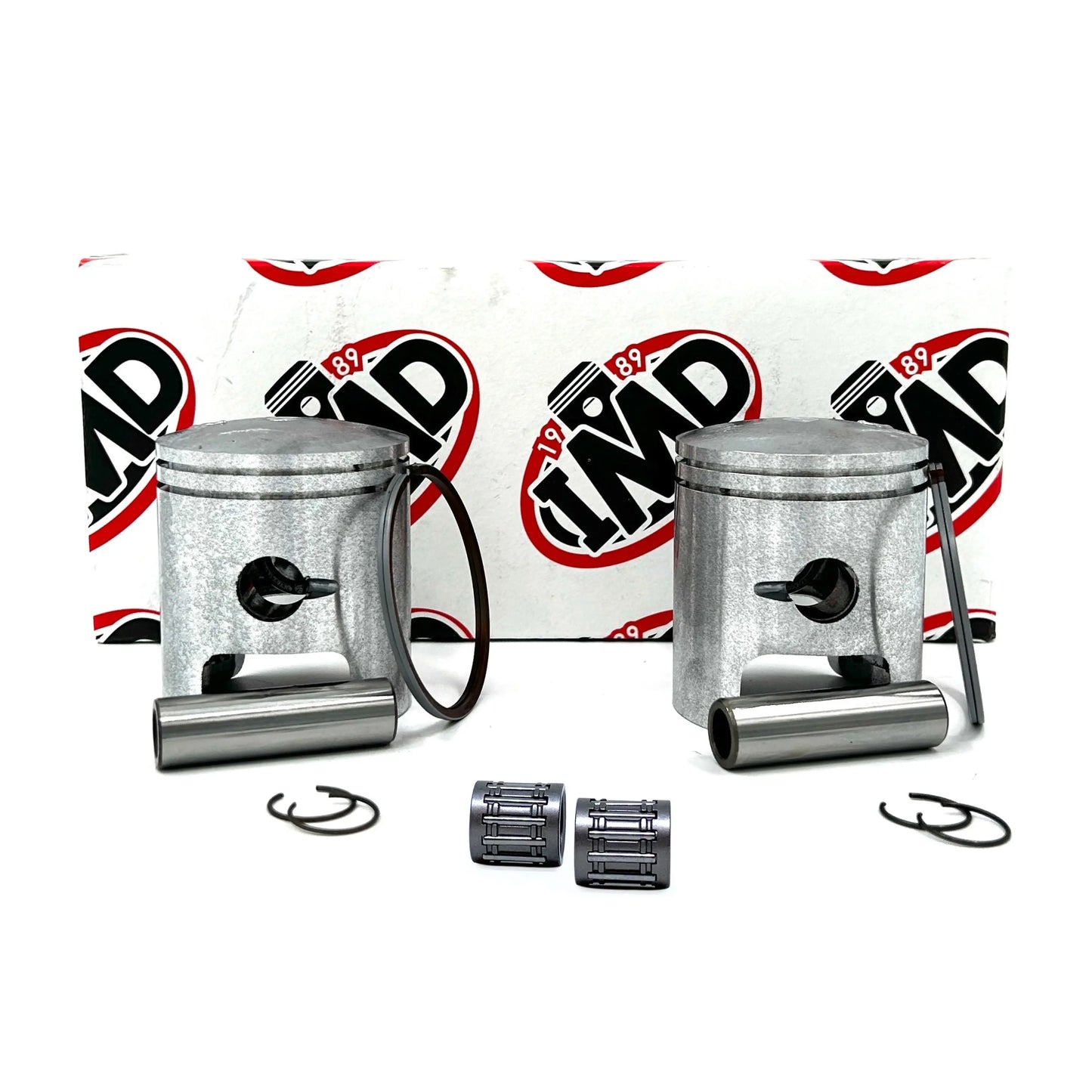 Two pistons with connecting rods and small end bearings against a white background with red and black branding elements.